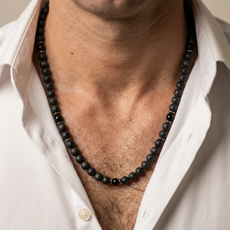 Men's black bead necklace on model