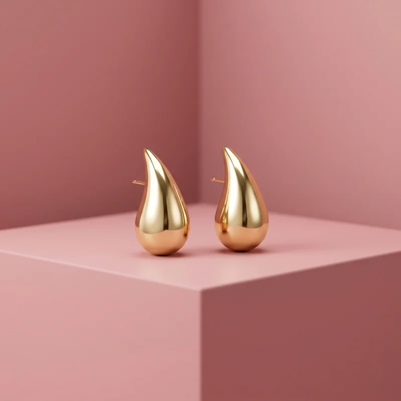 Romantic gold earrings on pink