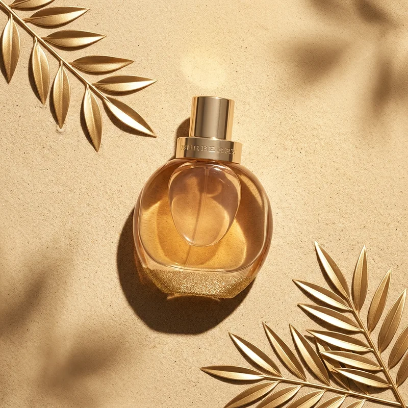 Luxury perfume on golden sand