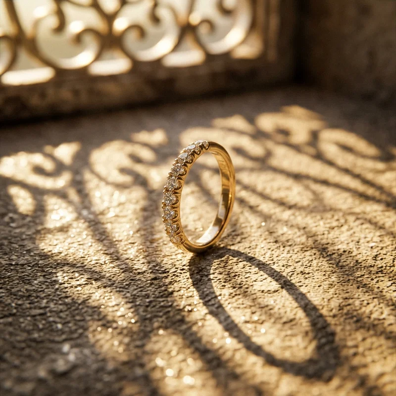 Gold diamond ring in sunlight shadows