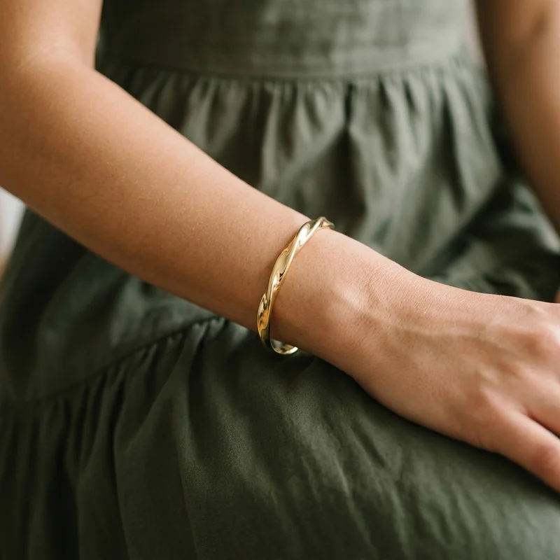 Chic gold bangle on linen model