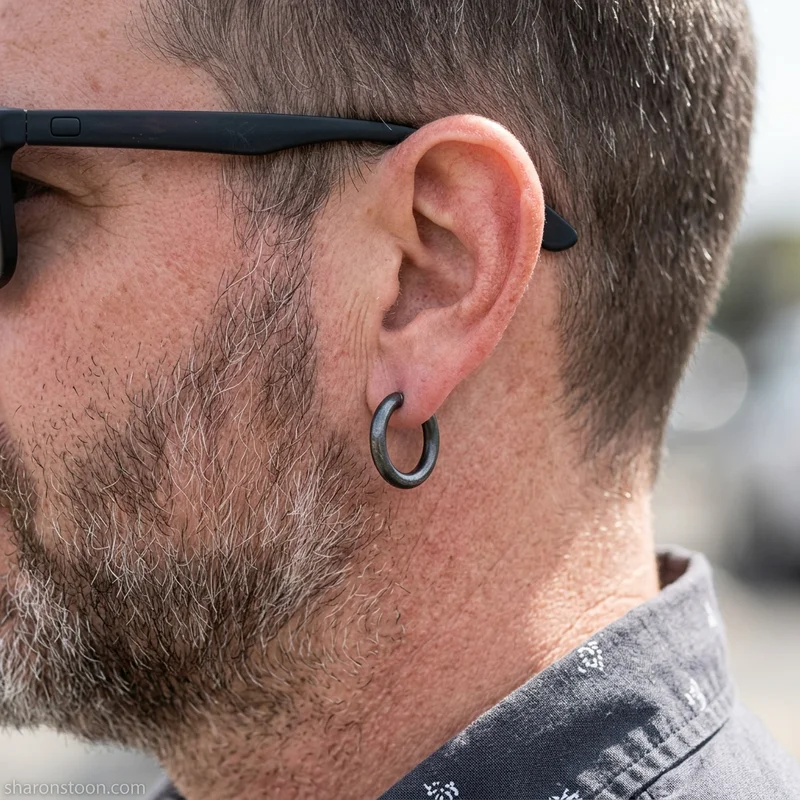 Minimalist hoop earring on model