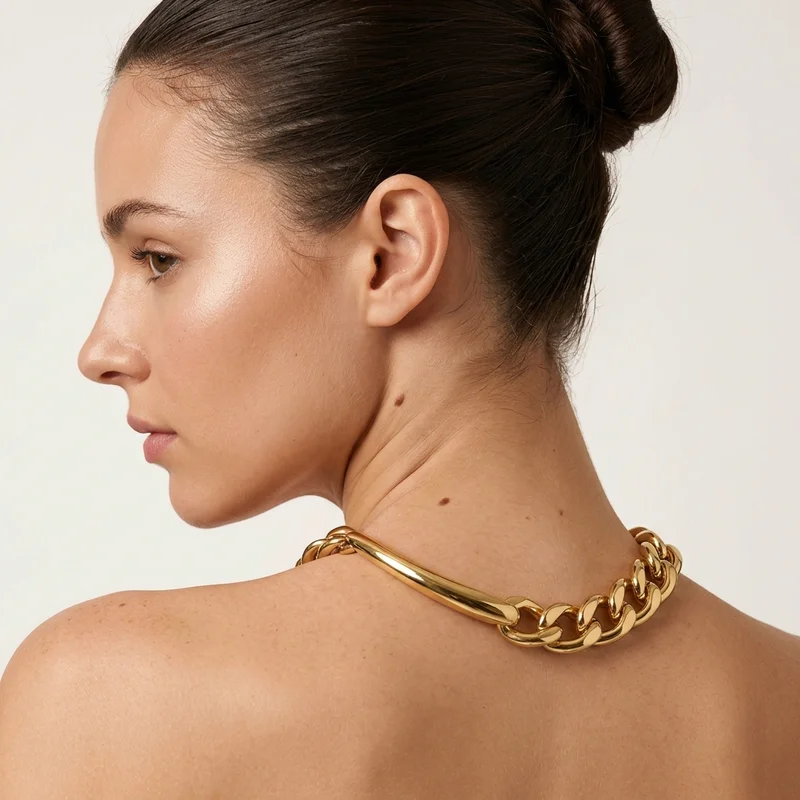 Gold chain necklace on model profile