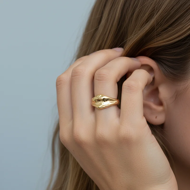 Organic gold ring on hand