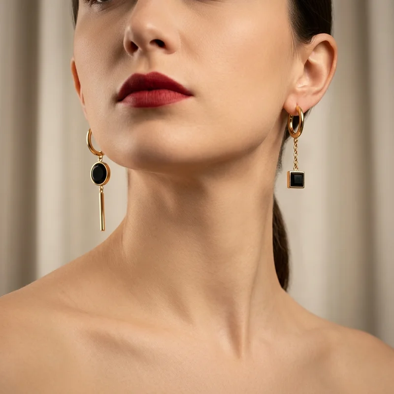 Model in gold and black earrings