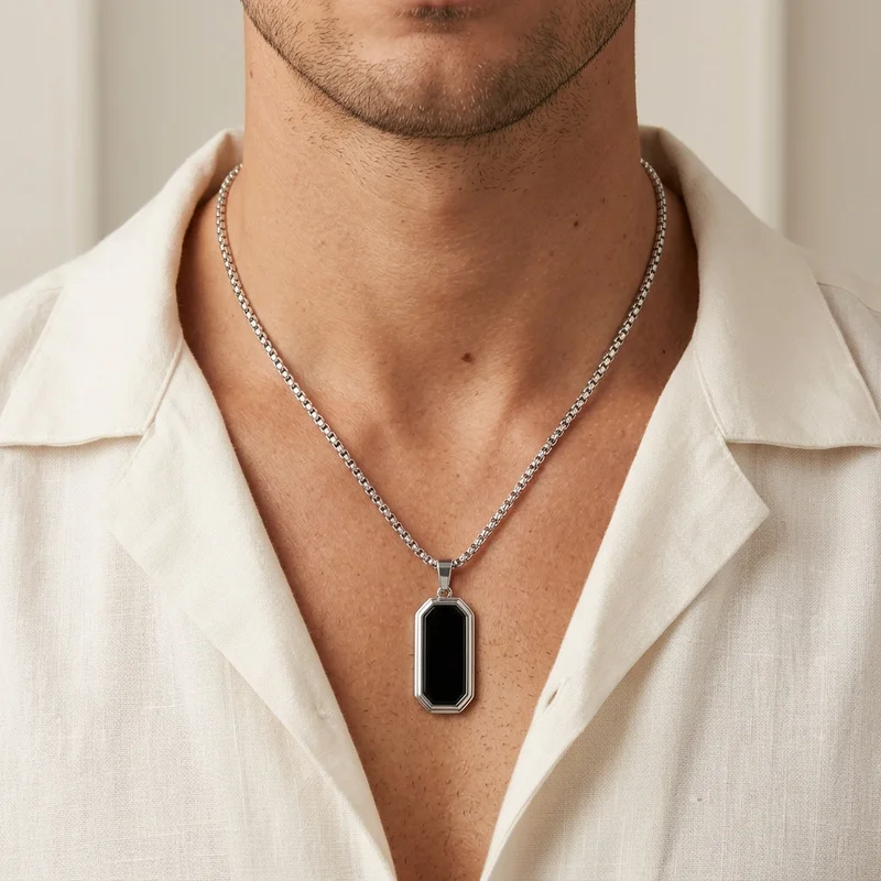 Men's black pendant necklace on model