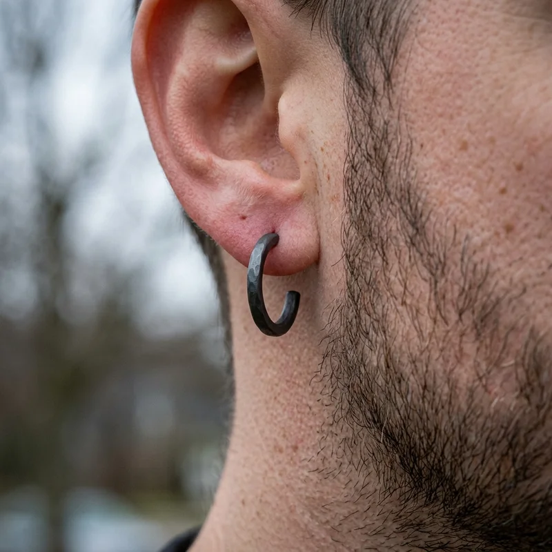 Hammered dark metal hoop earring