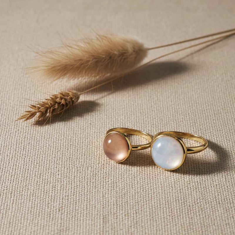 Minimalist gold rings on linen