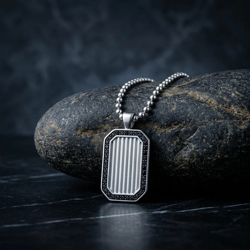 Men's dog tag necklace on black marble