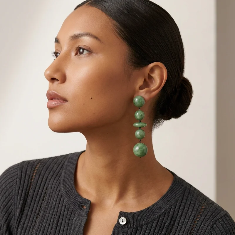Elegant jade earrings on model