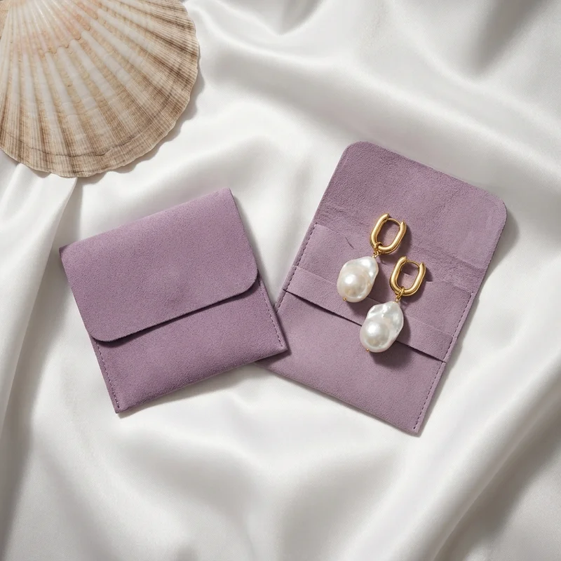 Pearl earrings on purple velvet