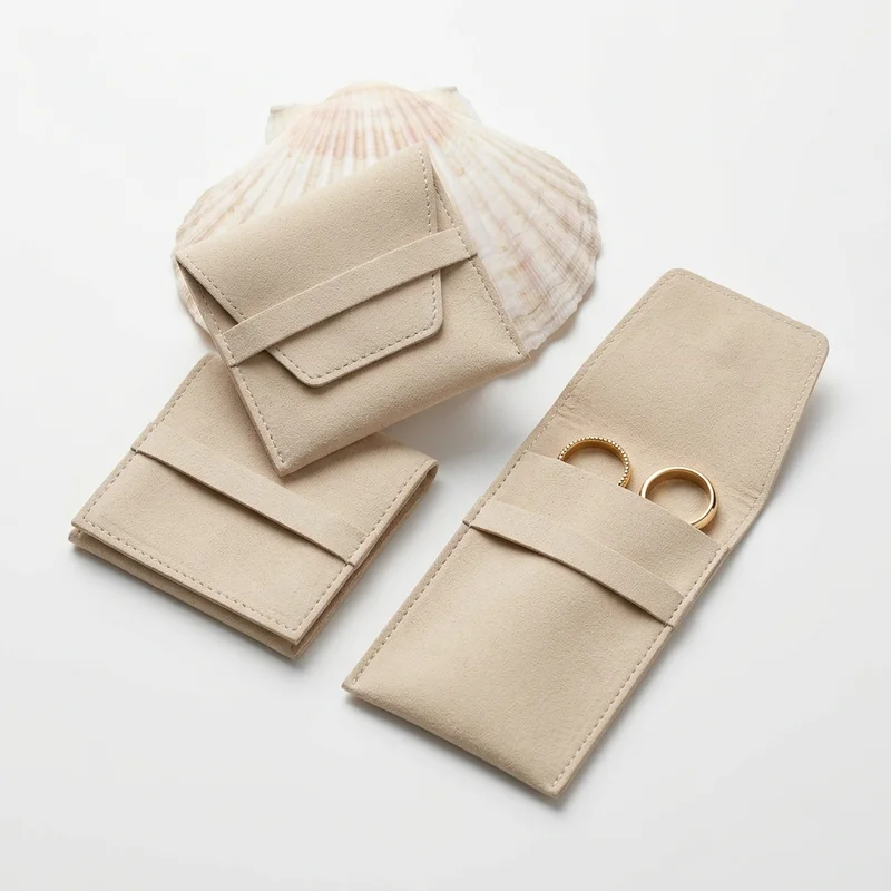 Beige suede pouches with seashell