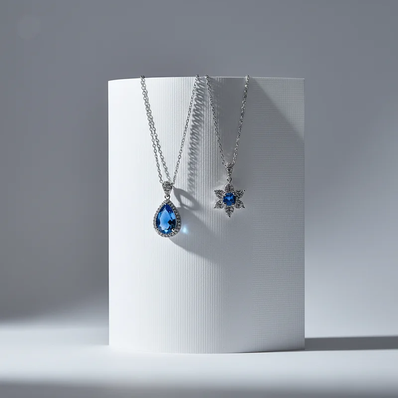 Elegant blue gem necklaces on pedestal