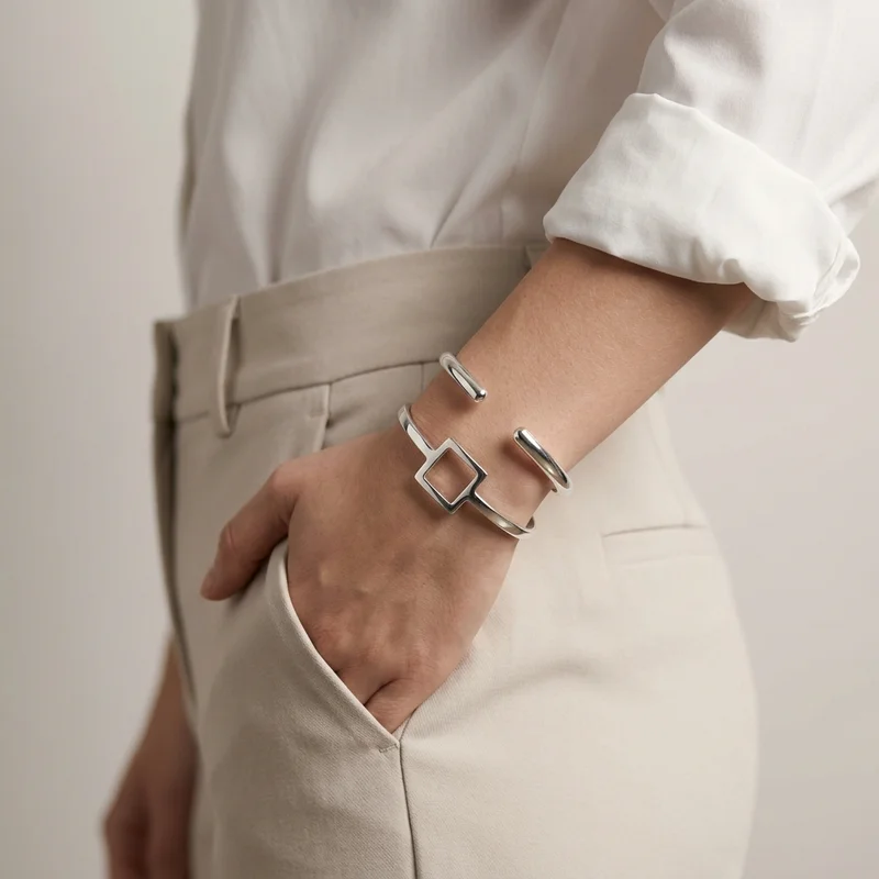 Modern silver bracelets on model