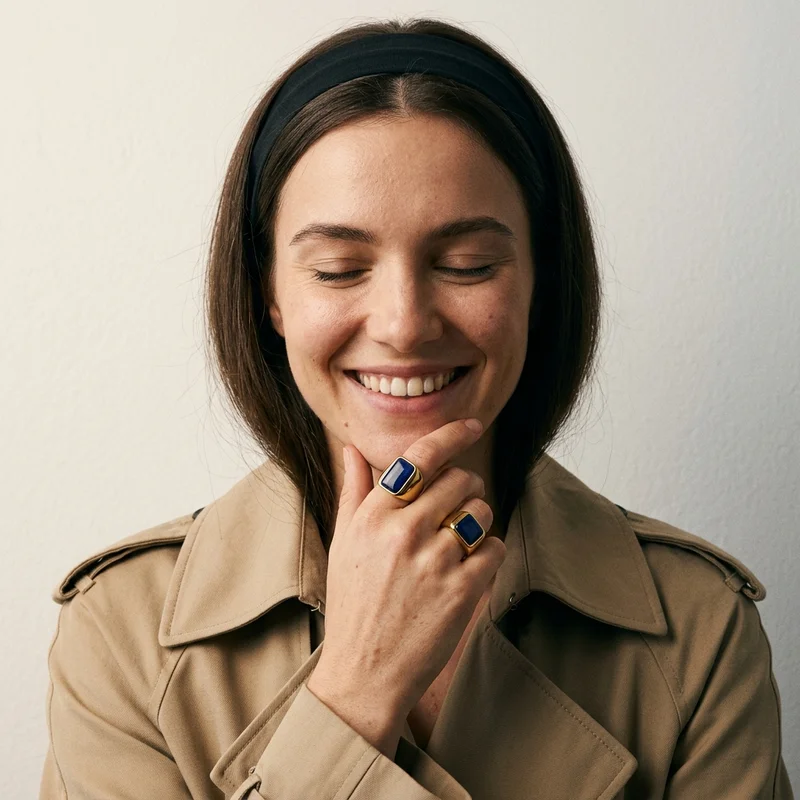 Elegant blue rings on smiling model