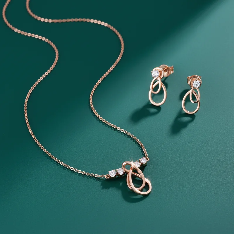 Rose gold jewelry set on green