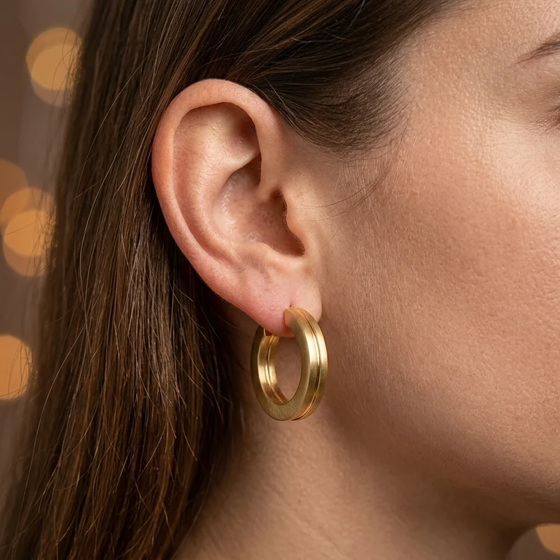 Sculptural gold earring
