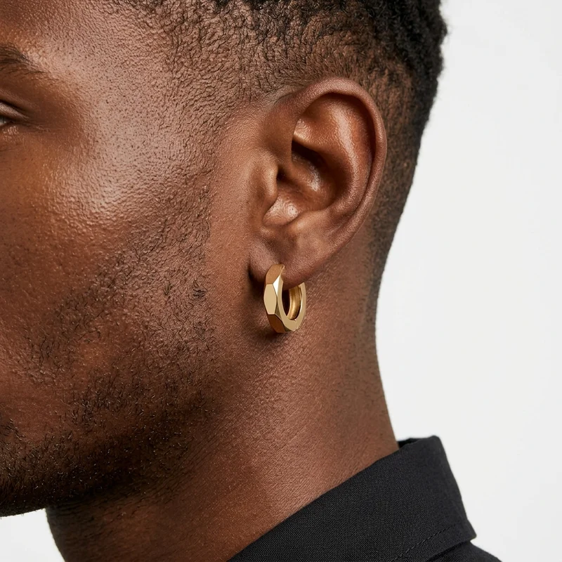 Geometric gold earring on model