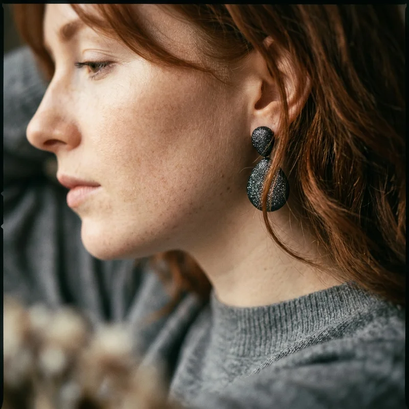 Chic glitter earrings on model