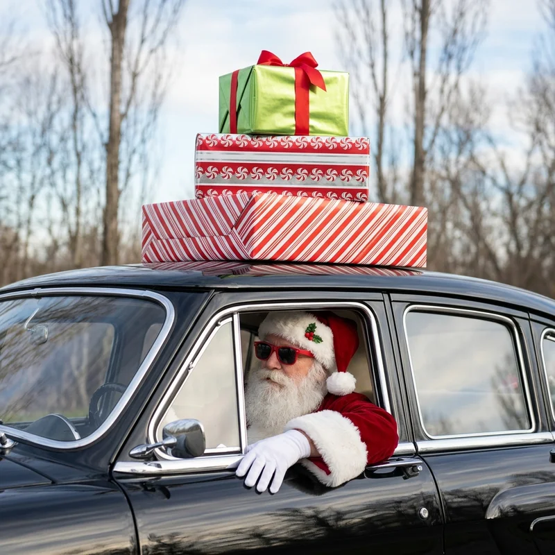 Festive Santa driving with gifts