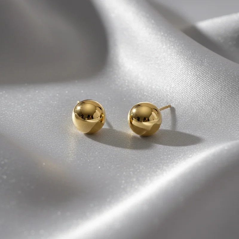 Elegant gold studs on satin