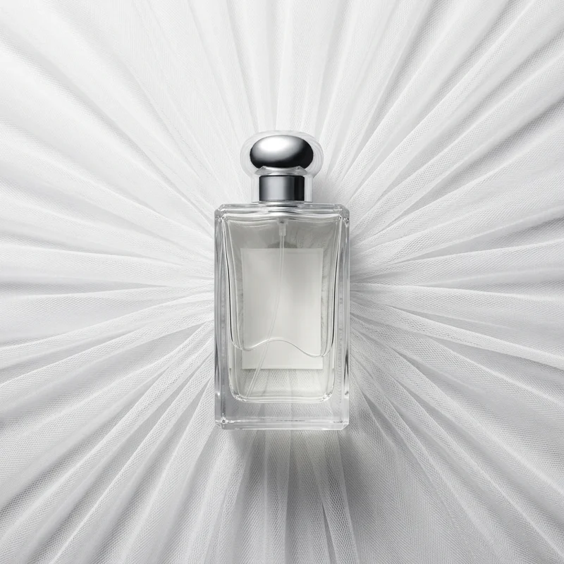 Elegant perfume on white tulle