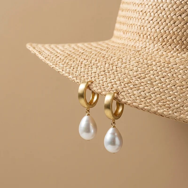 Summer pearl hoops on straw hat