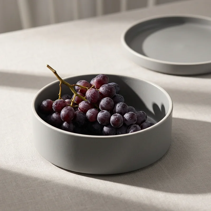 Minimalist grey bowl with grapes