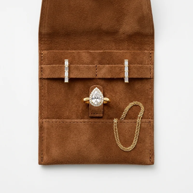Curated jewelry in brown suede