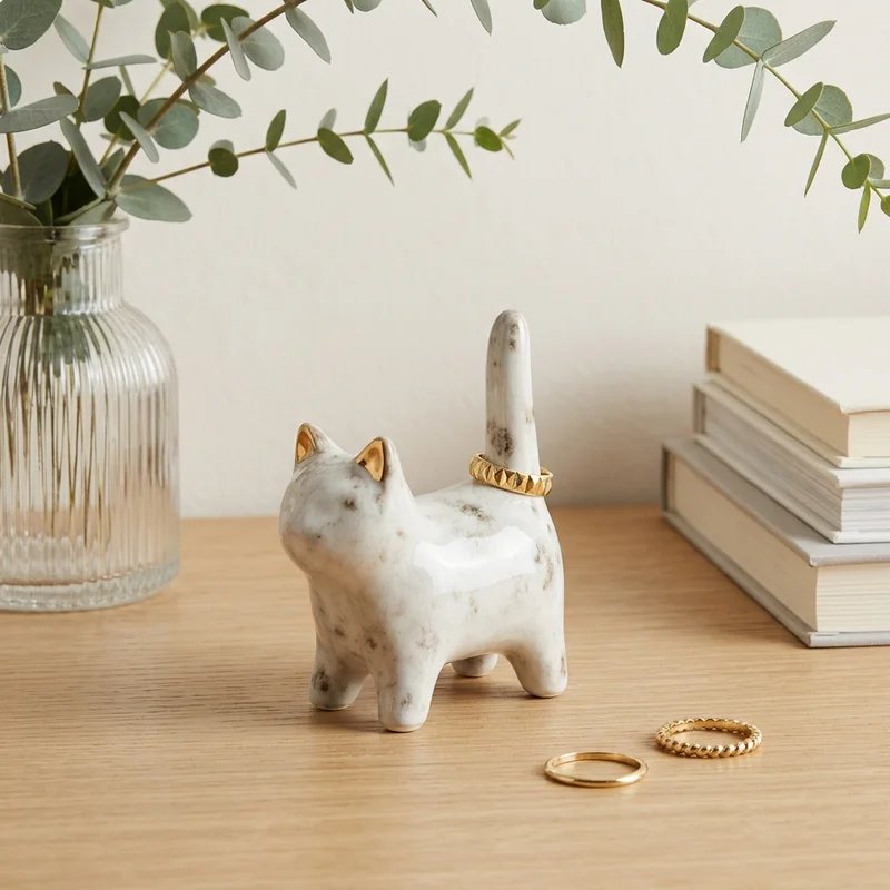 Marble cat ring holder on wood